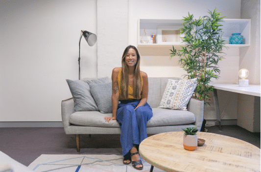 Mary Hoang founder of The Indigo Project sits in the psychology practice couch in Surry Hills