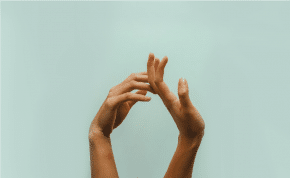 Hands on green background to show you how to feel more connected