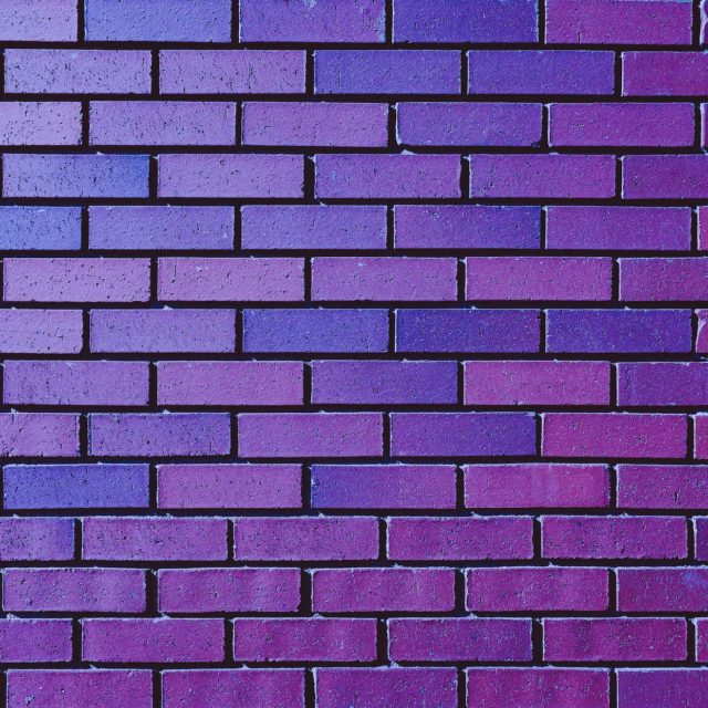 A wall of purple bricks