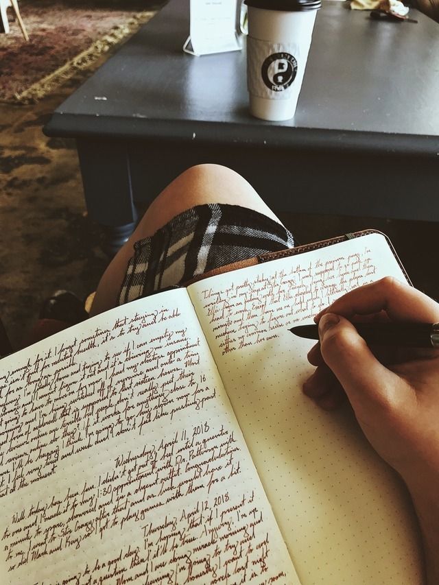Someone writes into a journal