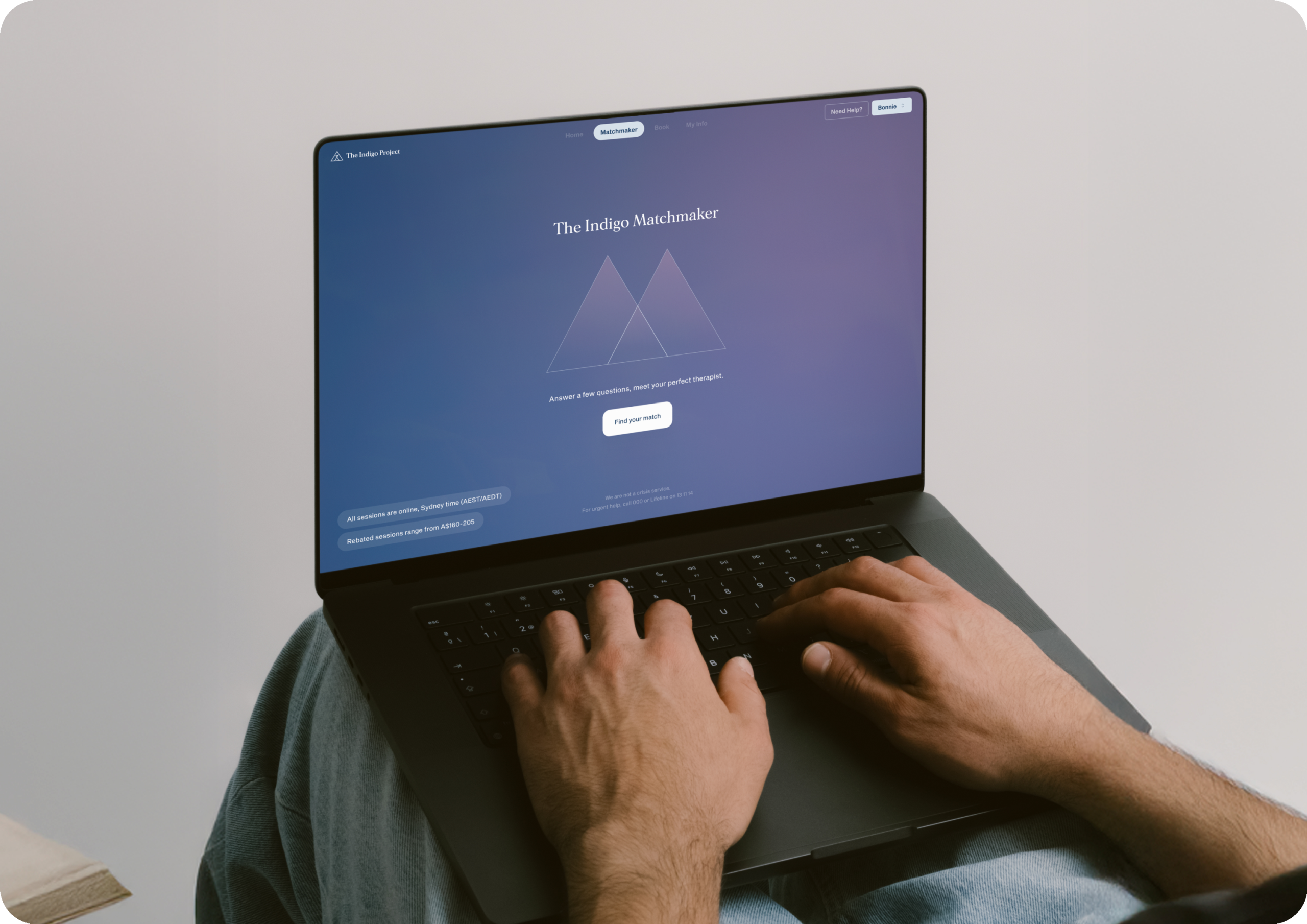 The Indigo Matchmaker home page is accessed from a laptop by someone sitting down